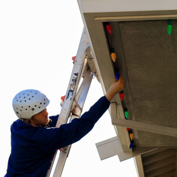 Ladder safety using a helmet when installing Christmas lighting